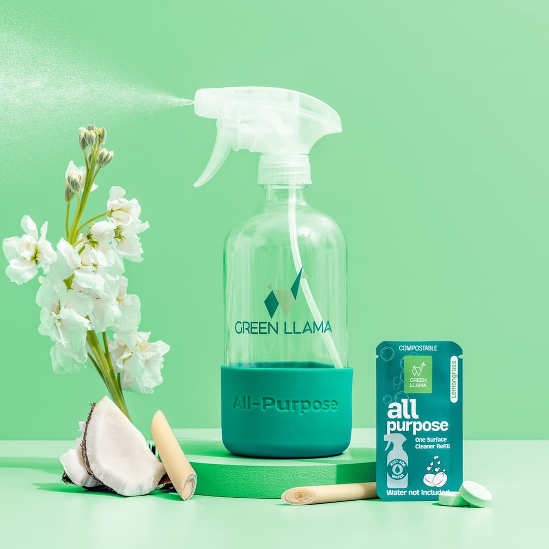 Green Llama all-purpose spray bottle with box, tablet, and cleaning accessories.