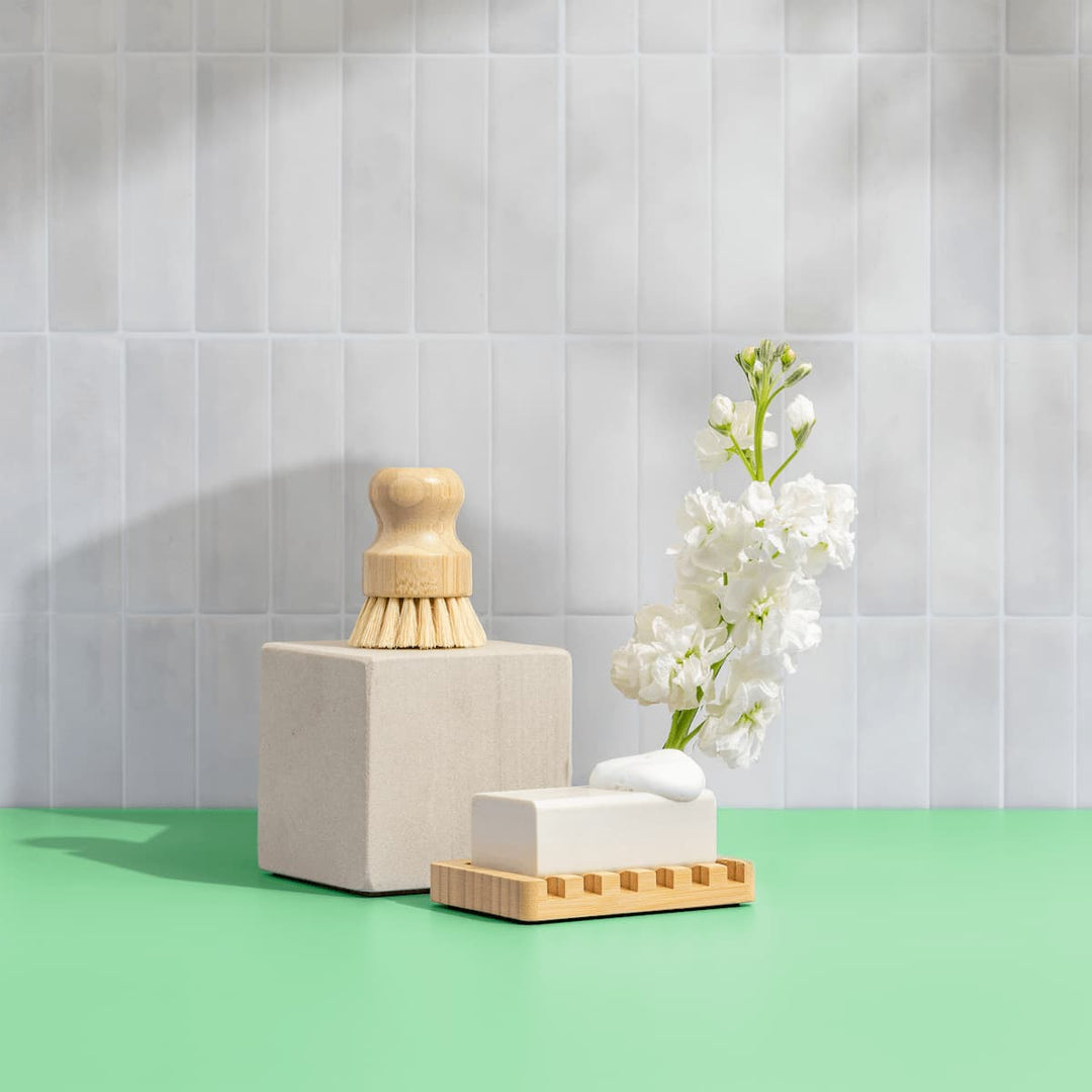 Dishwasher tabs set with wooden brush, white soap stone block, and tray