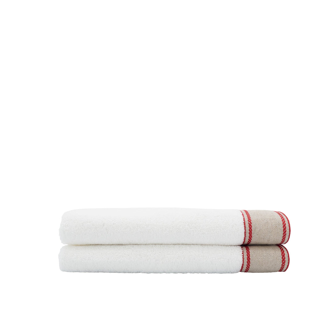 Stack of 2 white guest towels with red chain-style linen border, neatly rolled