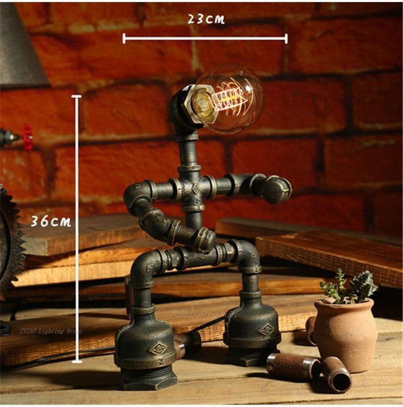 Steampunk pipe table lamp with exposed Edison bulb, dark metal, arched base stand