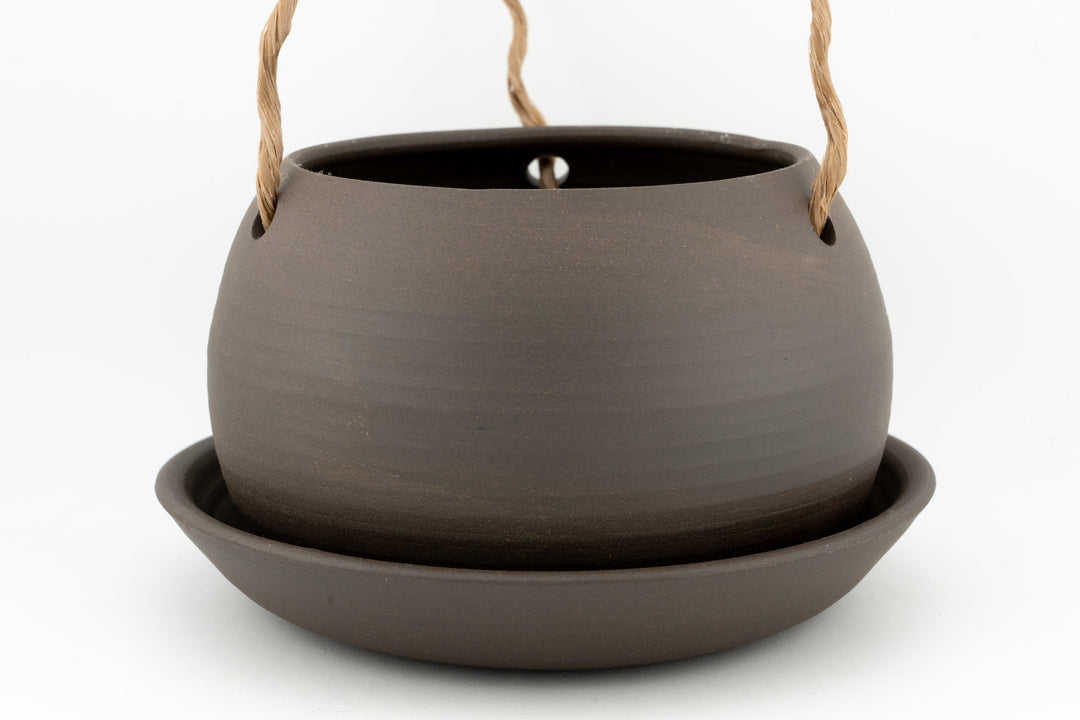 Dark gray glazed hanging planter pot with rope handles and drain hole