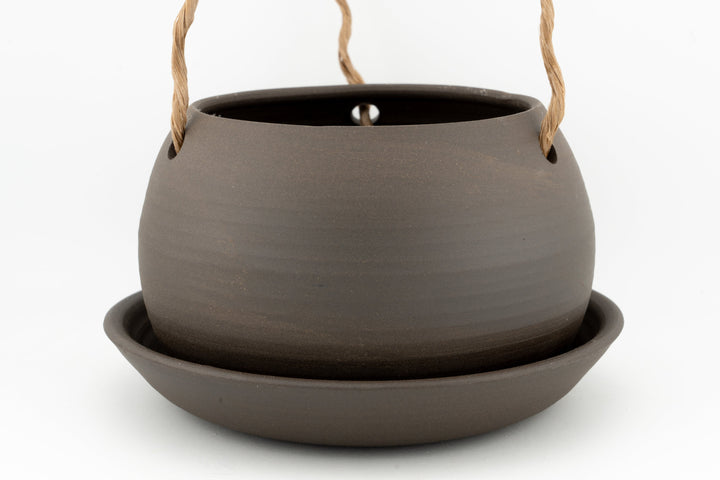 Dark gray glazed hanging planter pot with rope handles and drain hole