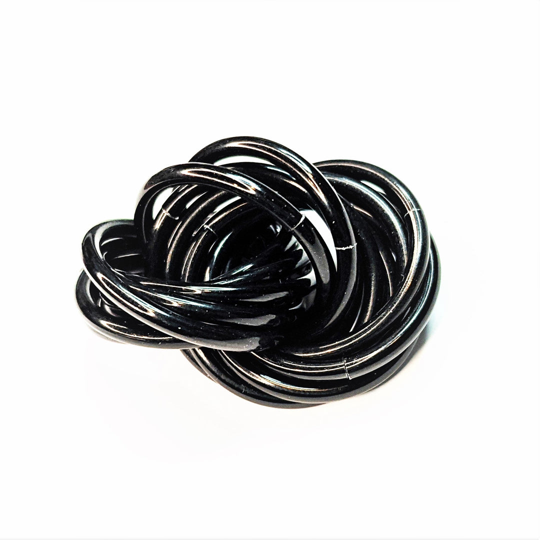 Swirled fidget stress ball, glossy black loops with reflective silver edges