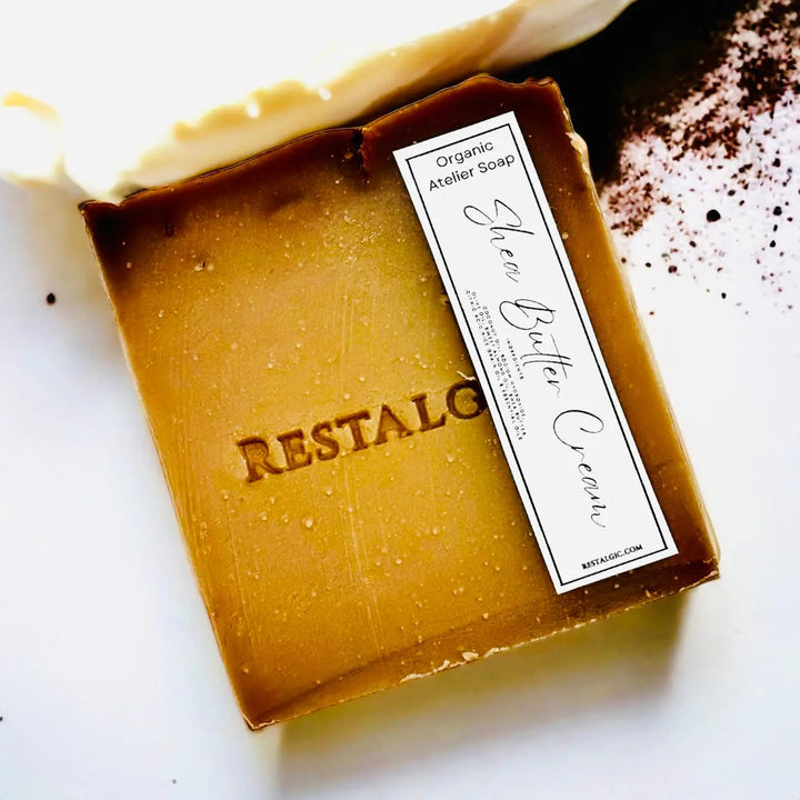 Amber handcrafted natural soap bar with organic Atelier Soap label.
