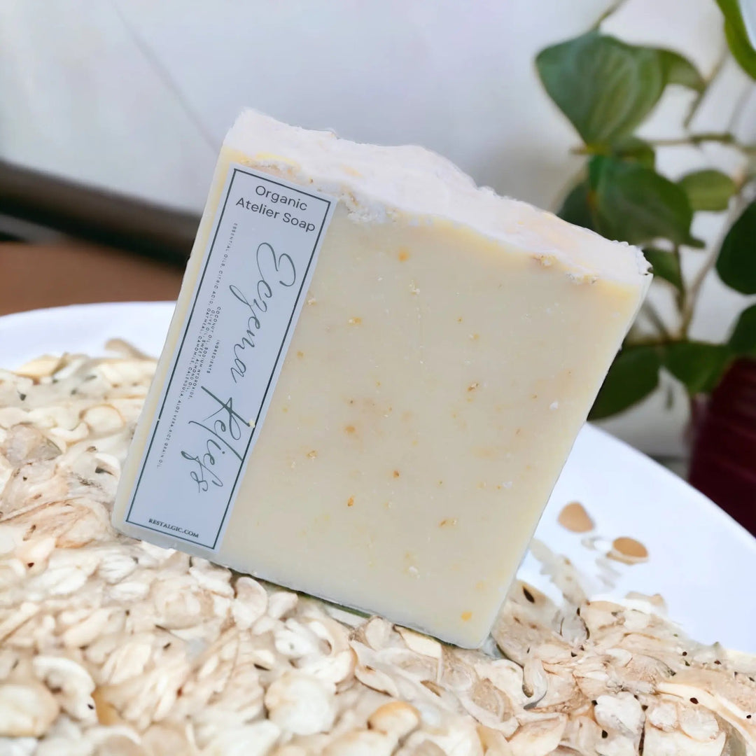 Cream handcrafted natural soap bar with organic Atelier Soap label.