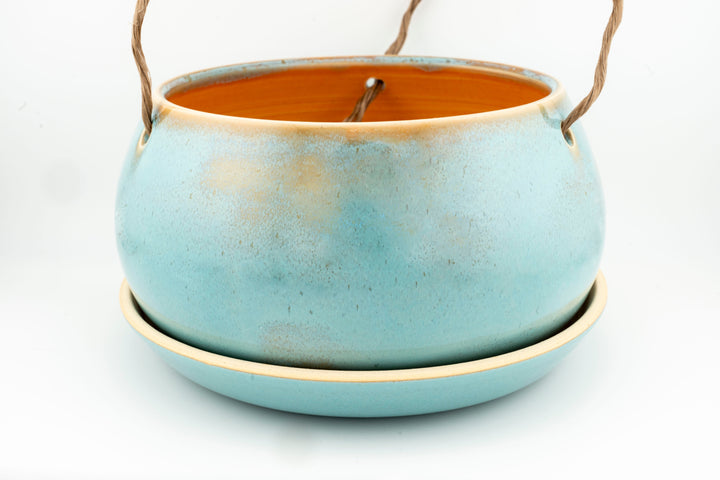 Glazed hanging planter with rope handles and round saucer base, aqua blue