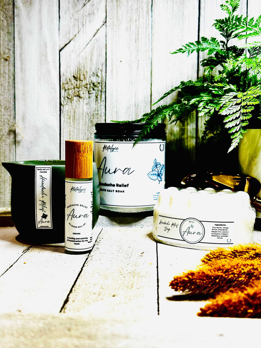 Aroma headache relief kit with candle jar, body wash soak tub, and roll-on bottles