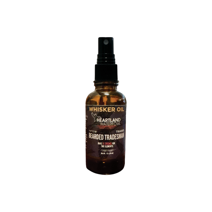 Whisker oil spray bottle with amber liquid and WHISKER OIL label