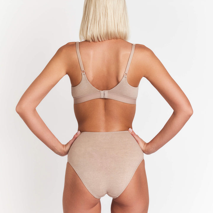 High-rise brief underwear in taupe beige, back view with high waist and seam detail.