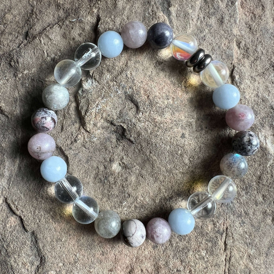 Round-stone bracelet with light-blue beads, gray speckled stones, and clear crystal accents