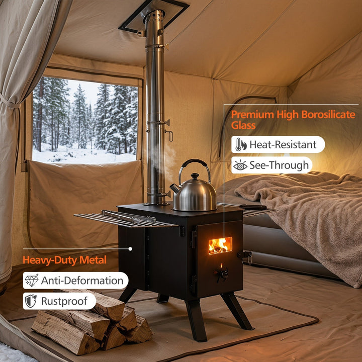 Black wood stove with fire in door and metal kettle on top, set up for camping