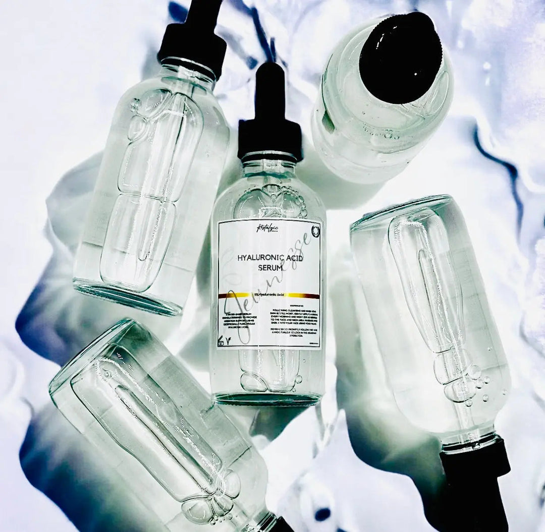 Hyaluronic acid serum bottles with pipette droppers, clear glass, dark caps, labels