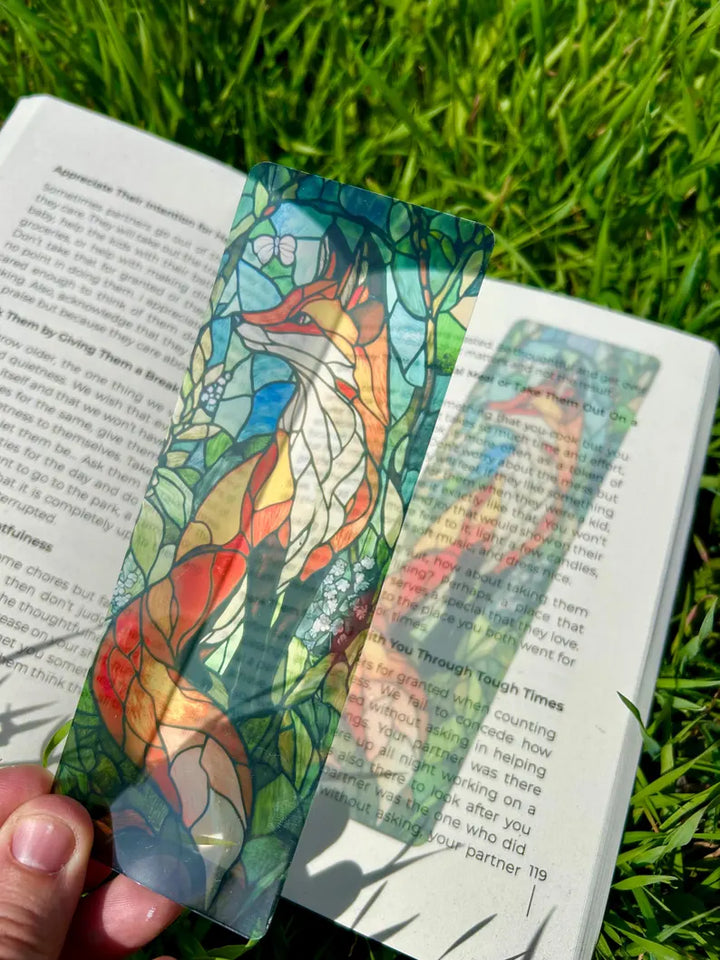 Stained-glass fox bookmark, multicolor blue-green and red fox figure on open book