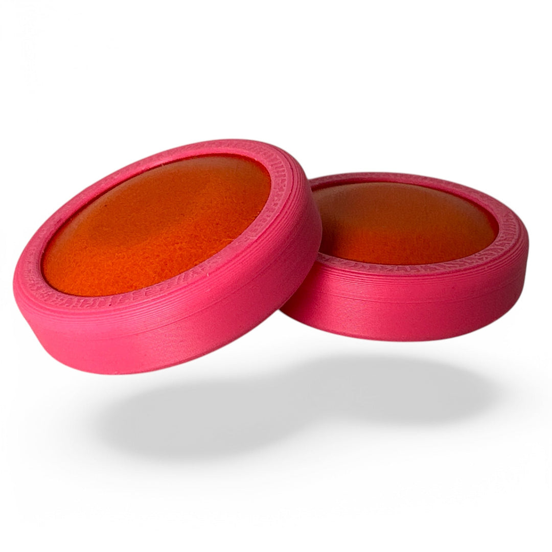 Fidget toy moon discs, orange inner with pink outer, two-piece pair