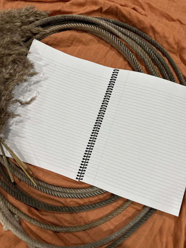 Santa Fe lined notebook open, lined pages with spiral binding