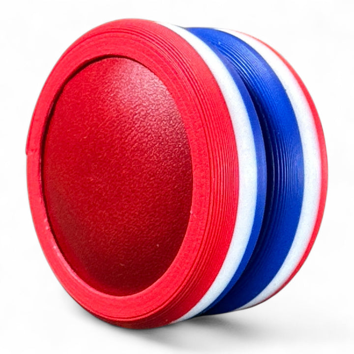Red and blue striped round stacking toy with textured oval opening