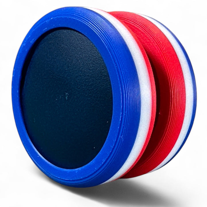 Blue and red striped round stacking toy with dark oval center opening