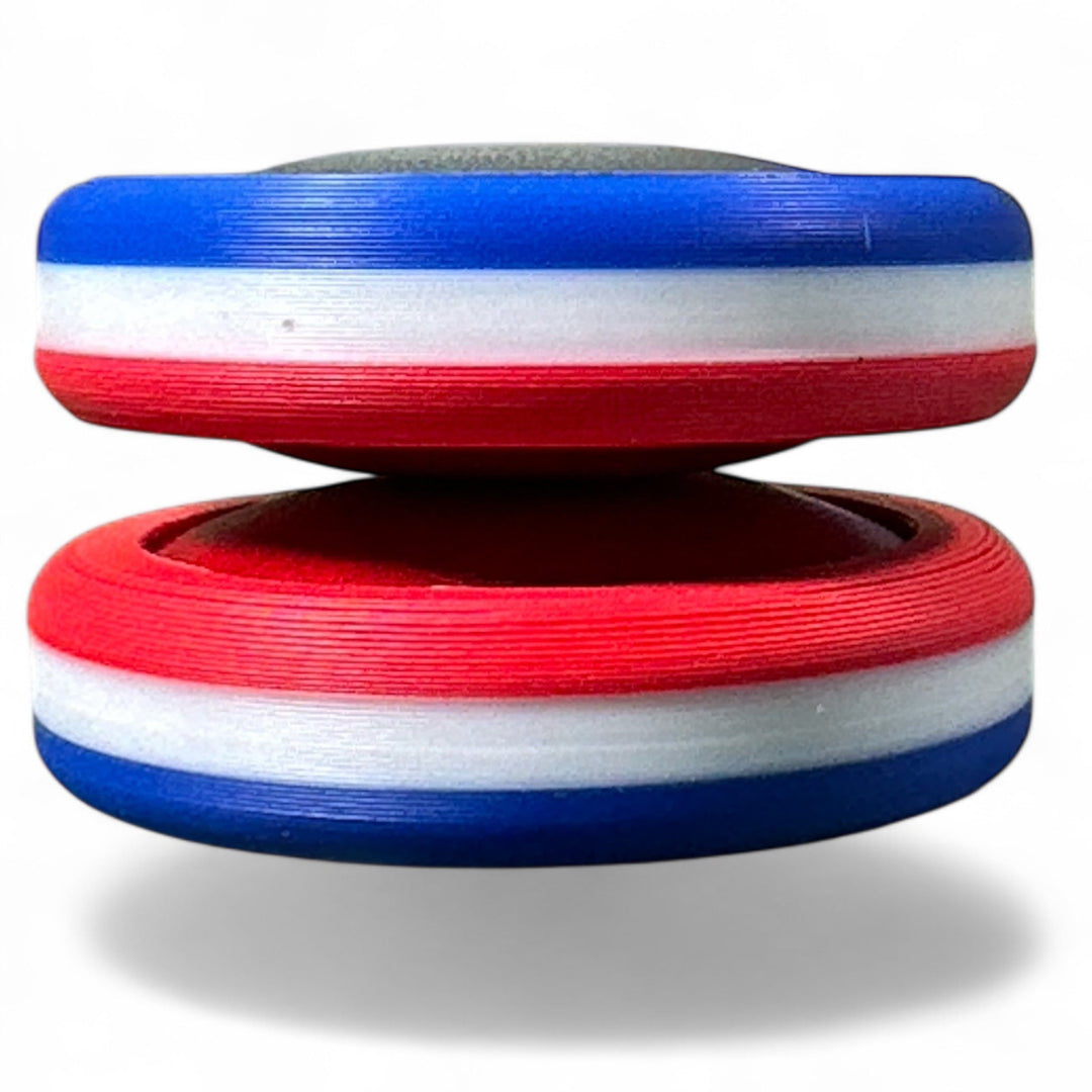 Red, white, and blue striped stacking toy viewed from side
