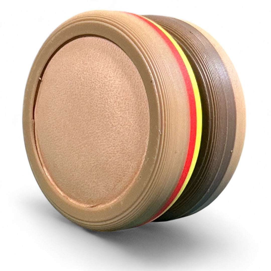 Tan round stacking toy with red and yellow-green accent stripe