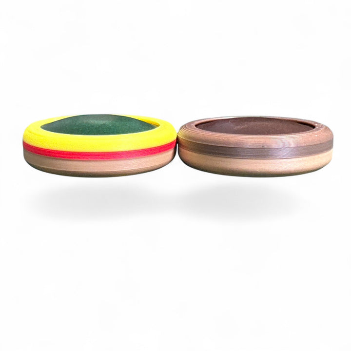 Two round striped stacking toys: yellow-green and brown with red stripe