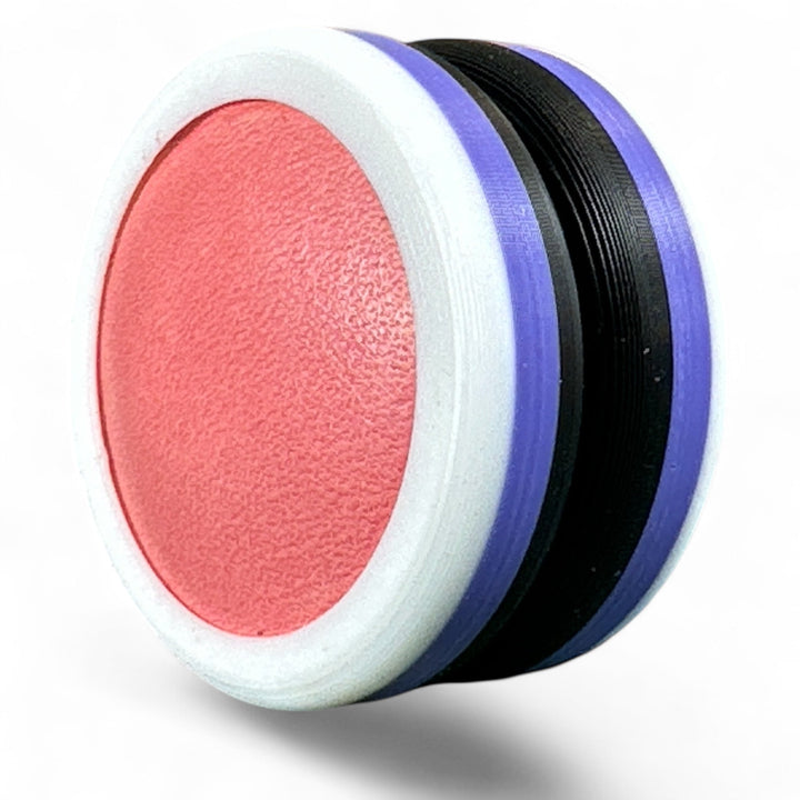 Close-up of pride round band with textured pink oval center and purple edge stripes