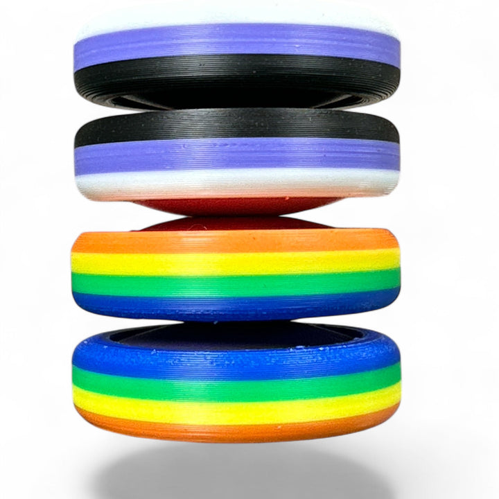 Stack of pride rainbow striped round bands in purple, orange, yellow, green, and blue