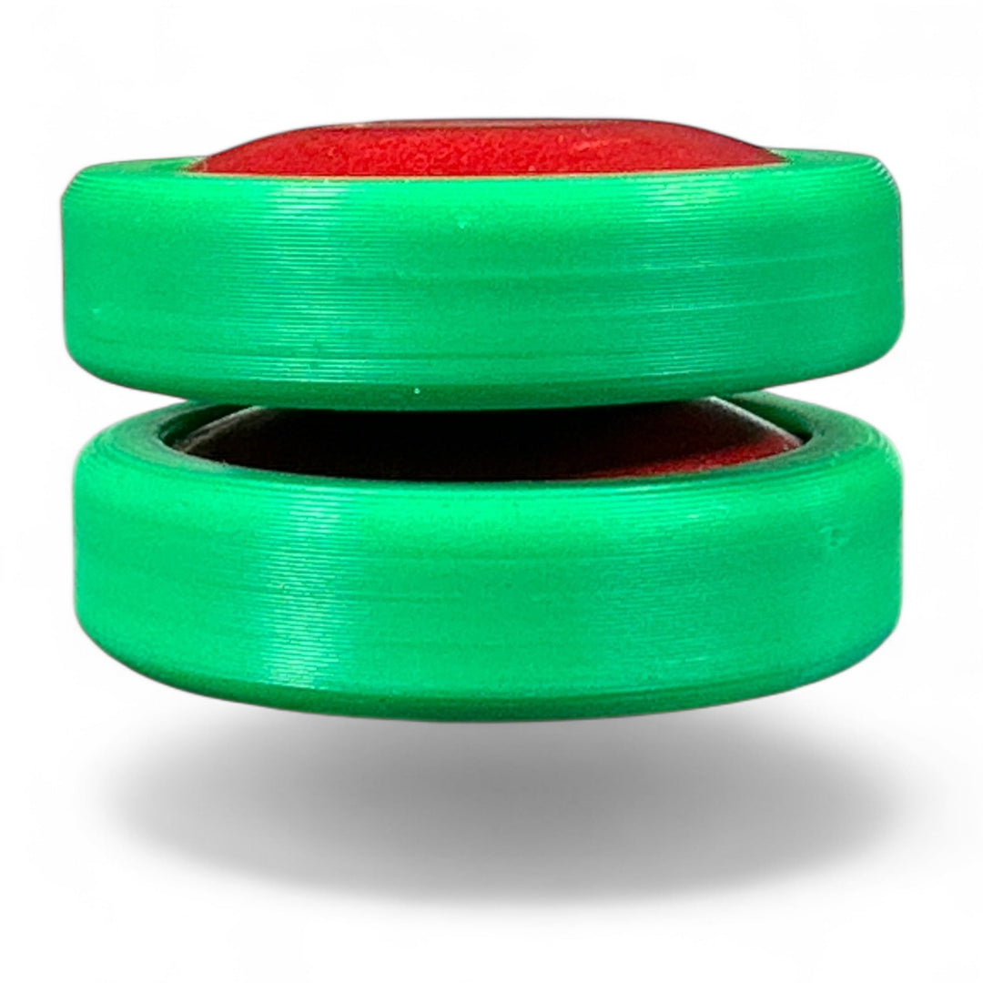Green stackable plastic discs with central opening