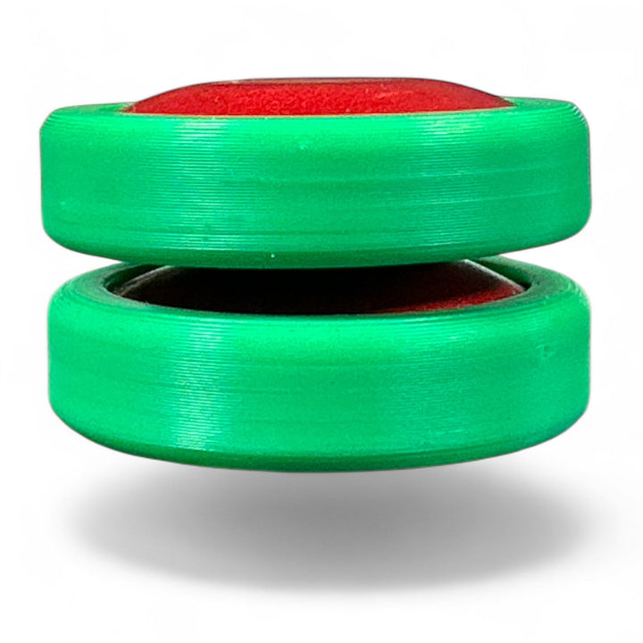 Green fidget rings with open center and a red top insert