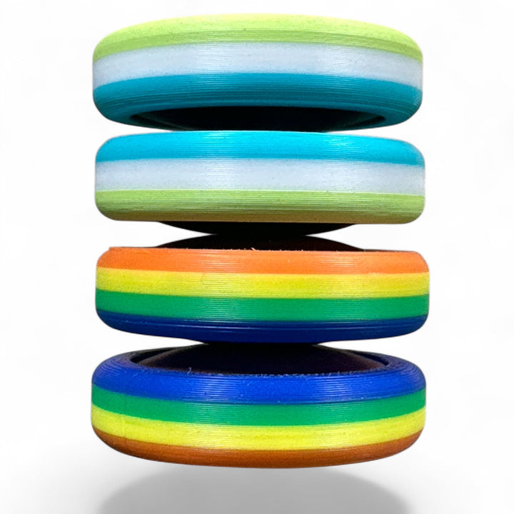 Stack of pride rainbow striped round bands in light green, blue, orange, and rainbow colors