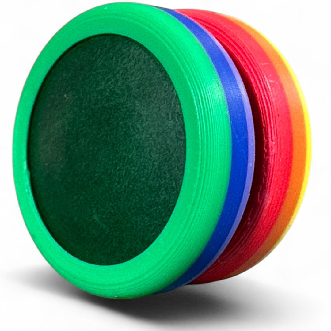 Rainbow pride ring with green, blue, red bands and dark inner oval.