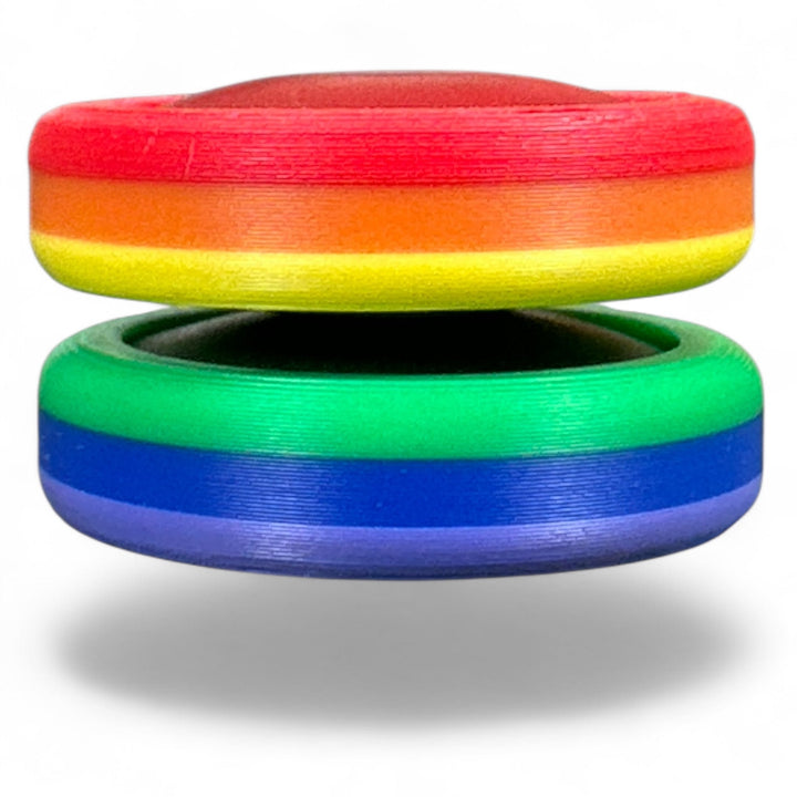 Rainbow pride ring stack with red, orange, yellow, green, blue bands.