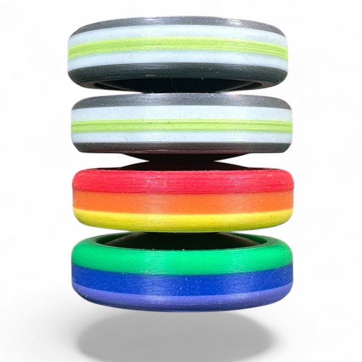 Pride Moons stacked rainbow discs with red, green, blue, and gray stripes