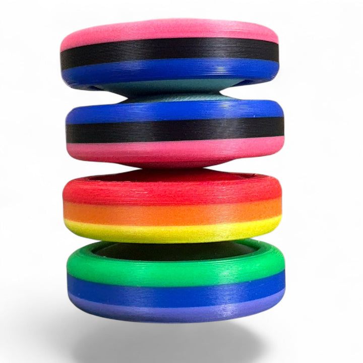 Pride Moons stacked rainbow discs with red, orange, yellow, green, and blue stripes