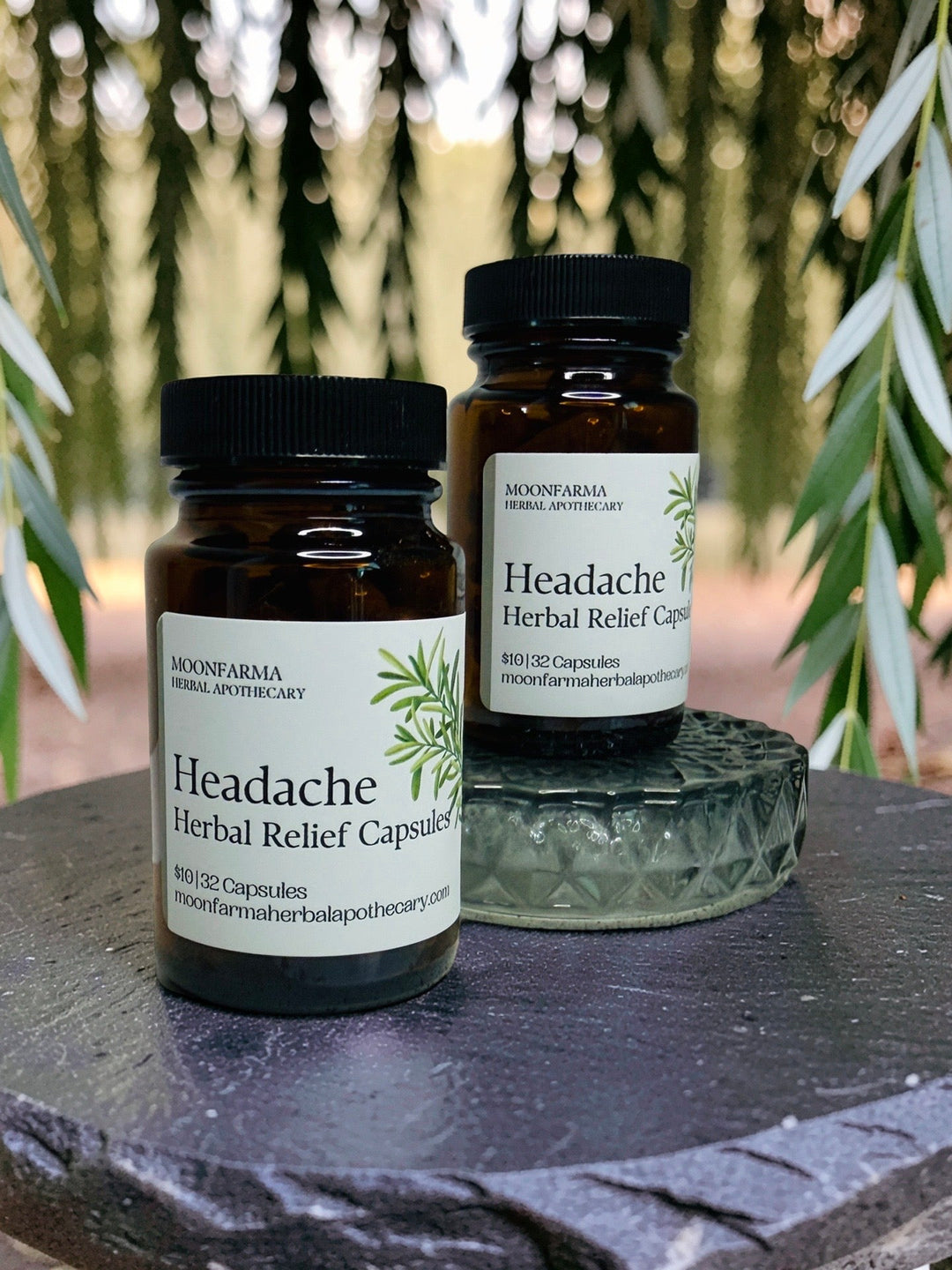 Headache relief herbal capsules bottles in amber glass with black caps