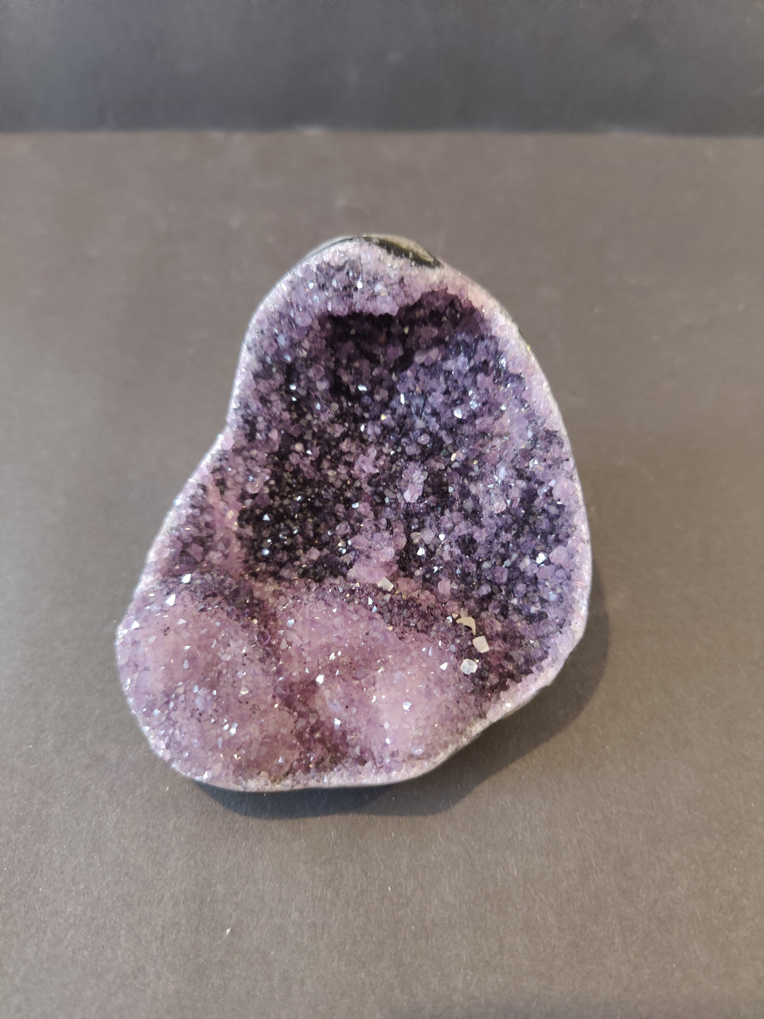 Amethyst geode crystal sculpture with purple druzy interior, heart-shaped