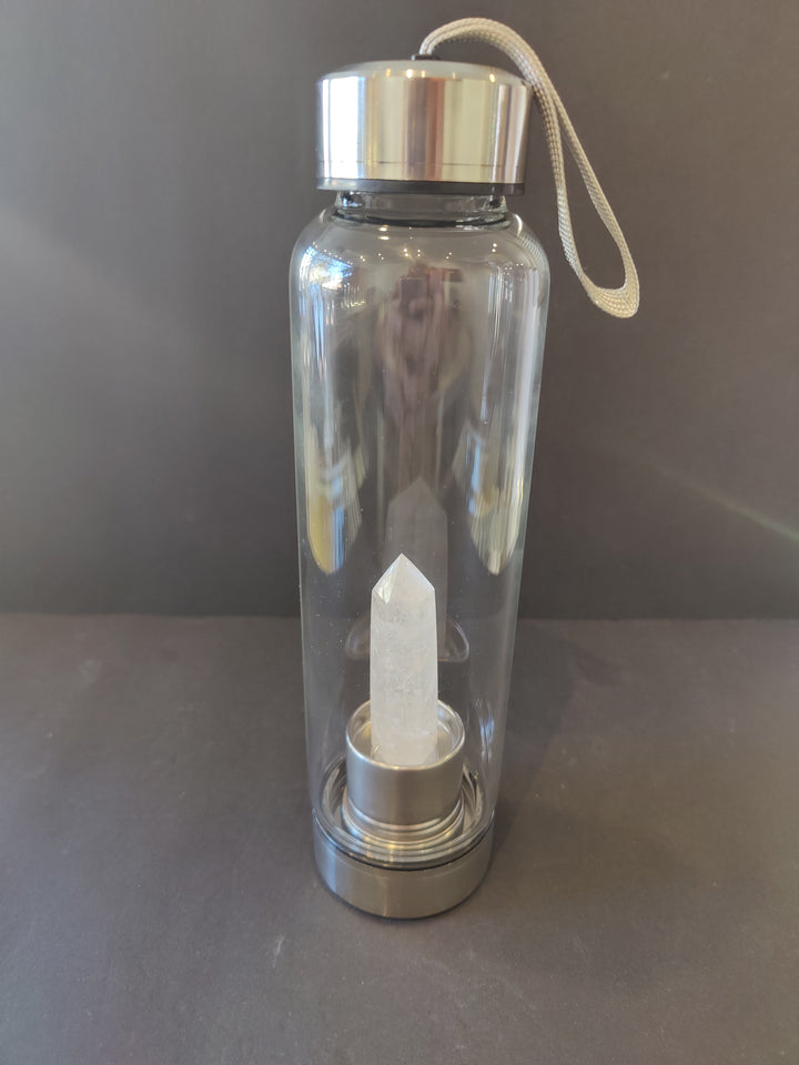Crystal-infused glass water bottle with stainless steel cap and white crystal insert