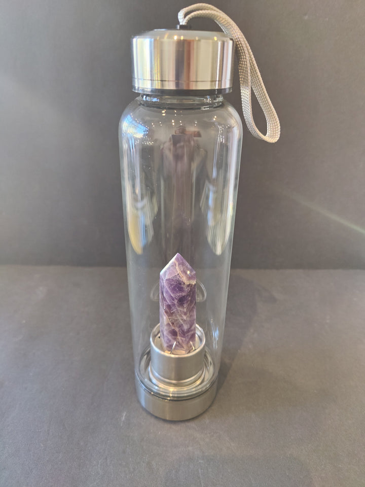 Crystal-infused glass water bottle with stainless steel cap and purple crystal insert