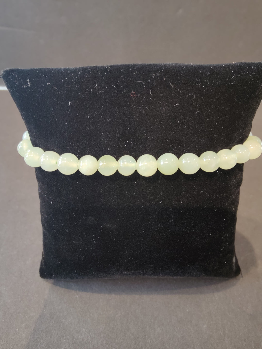 Beaded stone bracelet with 6mm pale white opal-like round beads.