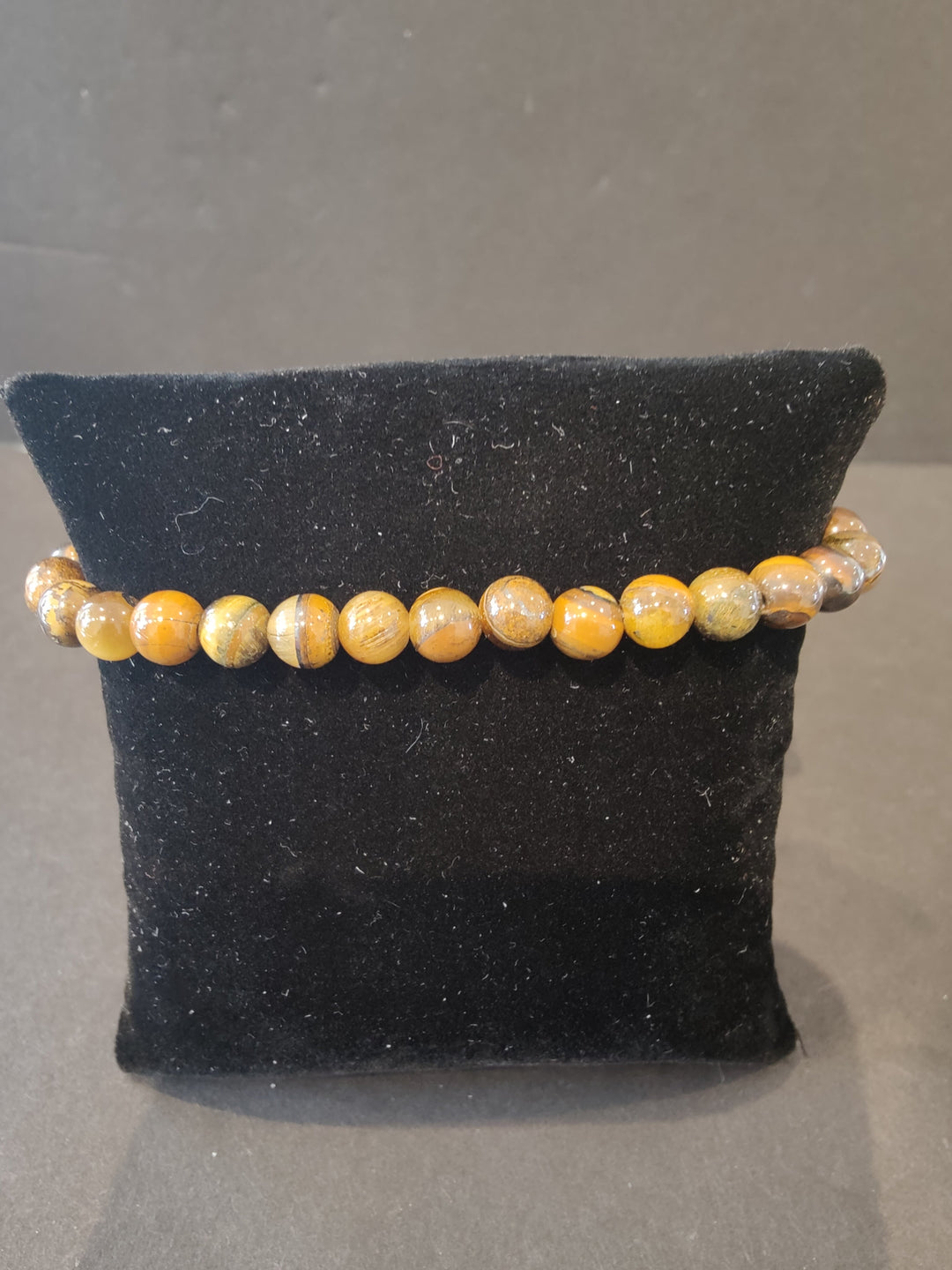 6mm beaded stone bracelet with orange and tan round beads