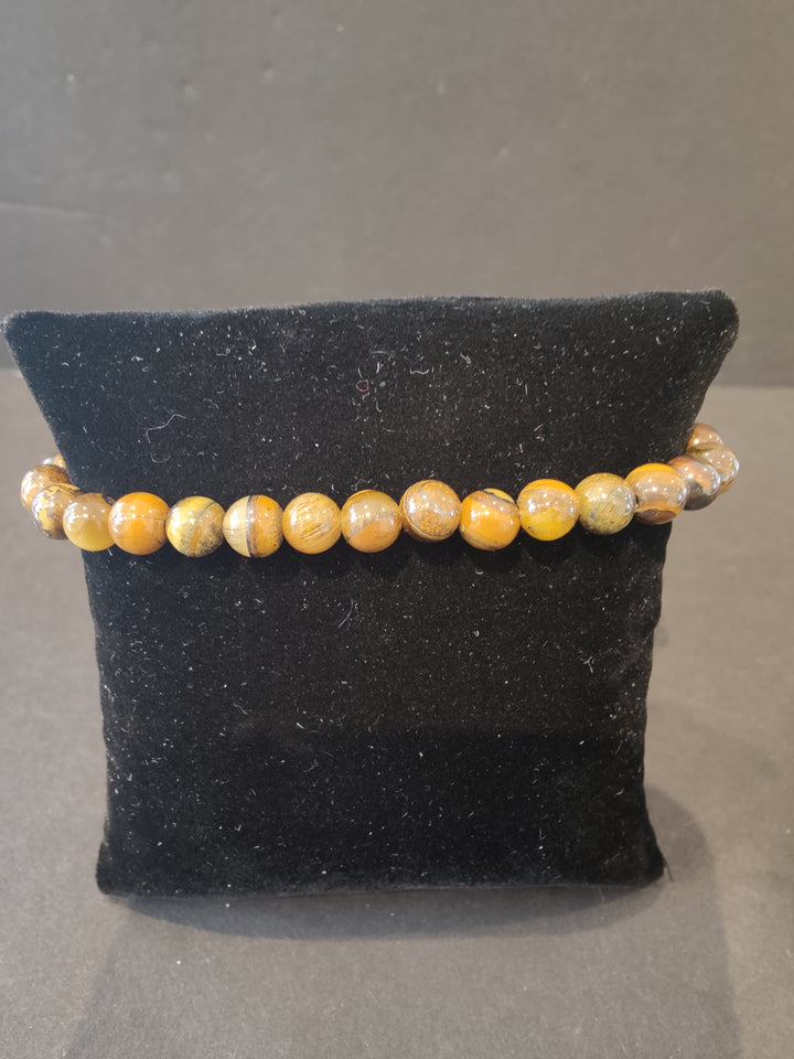 6mm beaded stone bracelet with orange and tan round beads