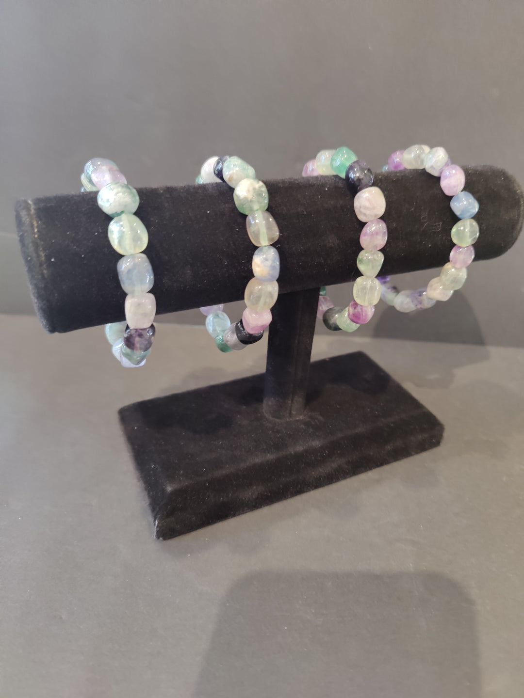 Rainbow fluorite beaded bracelet with pastel pink, green, and white round stones