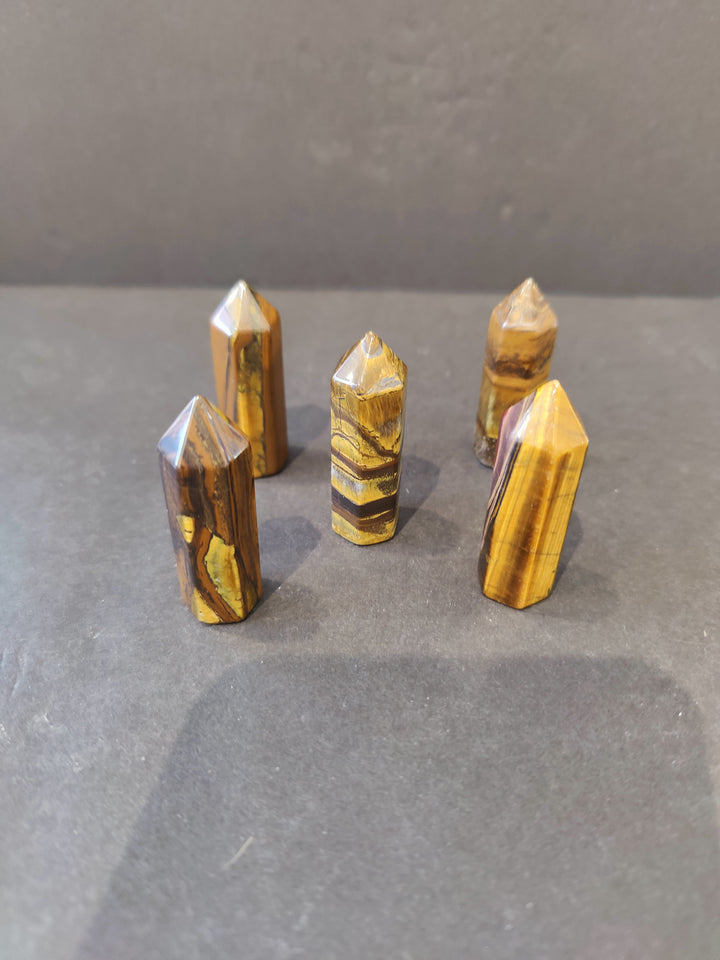 Tiger Eye crystal tower sculpture, faceted golden stone with pointed tops