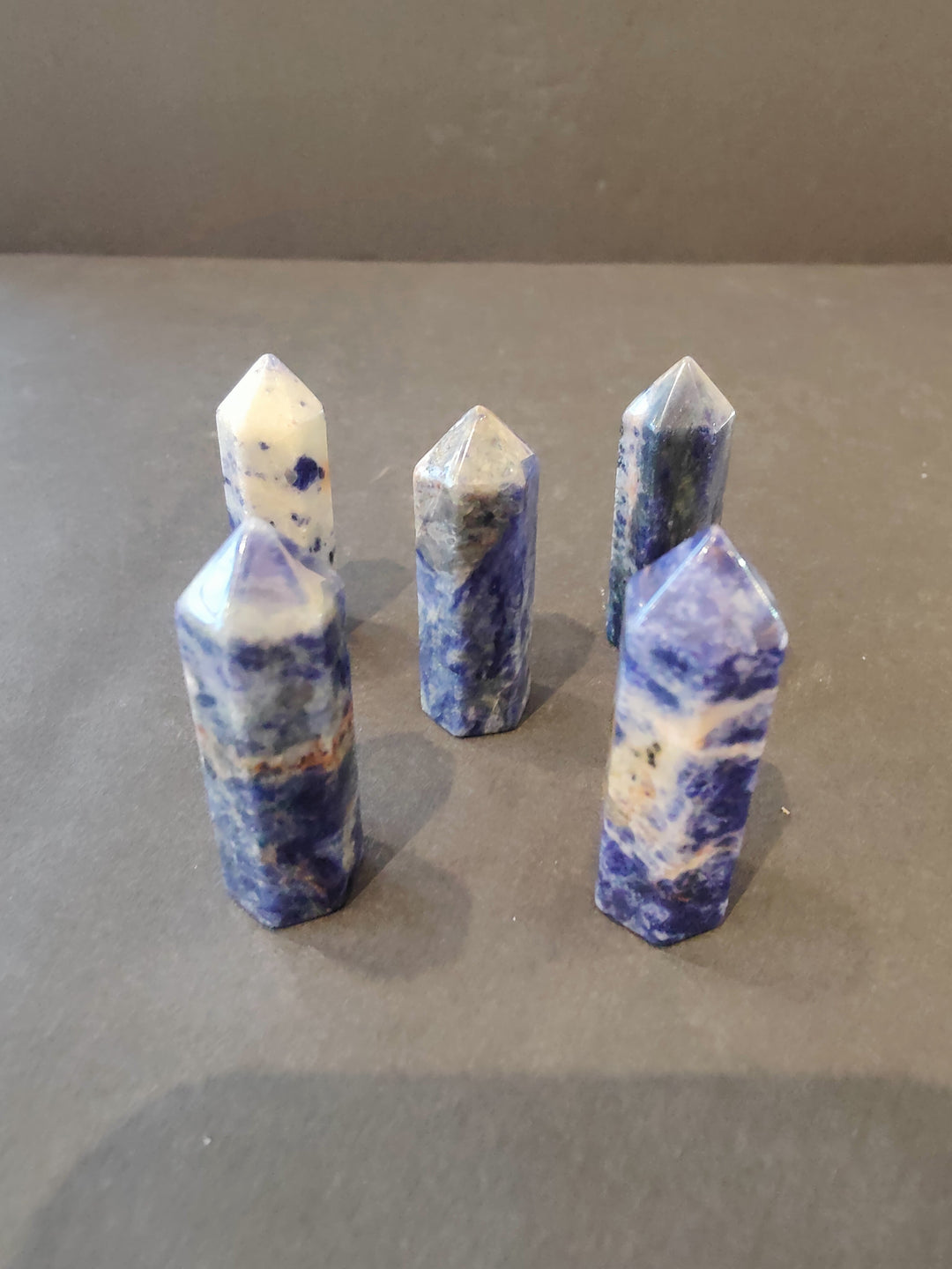 Blue and white crystal tower sculpture set with faceted tops and pointed bases
