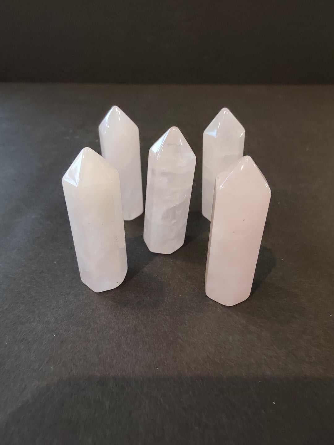 Pale white crystal tower sculpture set with faceted tops
