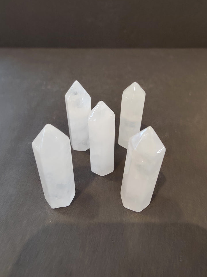 White crystal tower sculpture set with faceted tops and pointed bases
