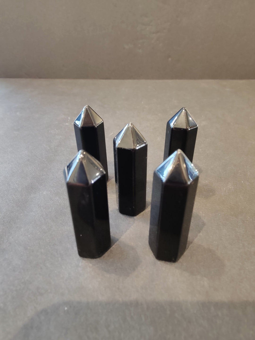 Black crystal tower sculpture set with reflective faceted points