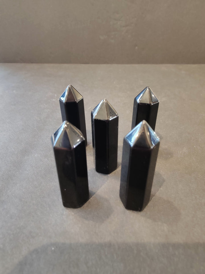 Black crystal tower sculpture set with reflective faceted points