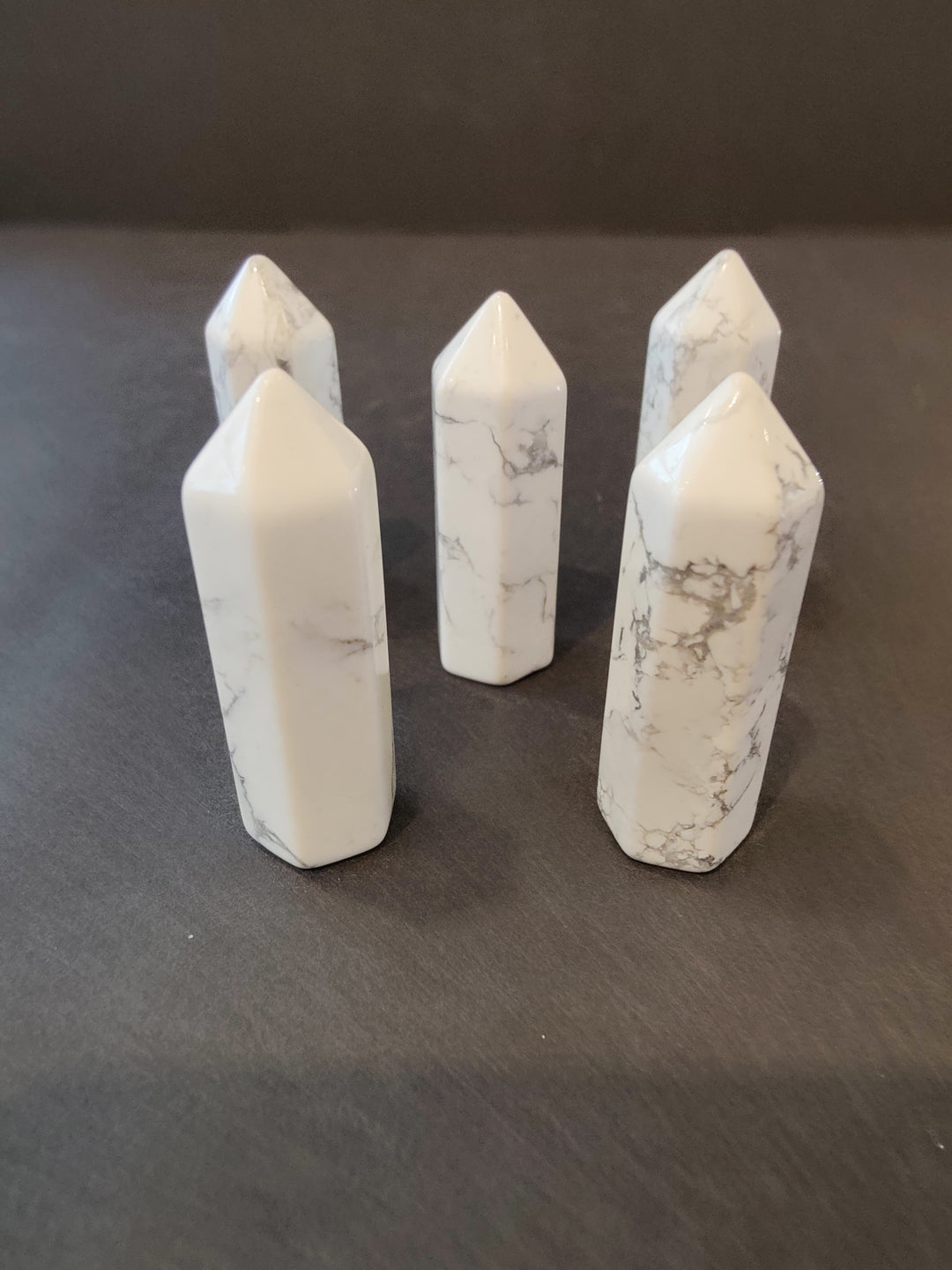 White crystal tower sculpture set with subtle grey veining and faceted tops