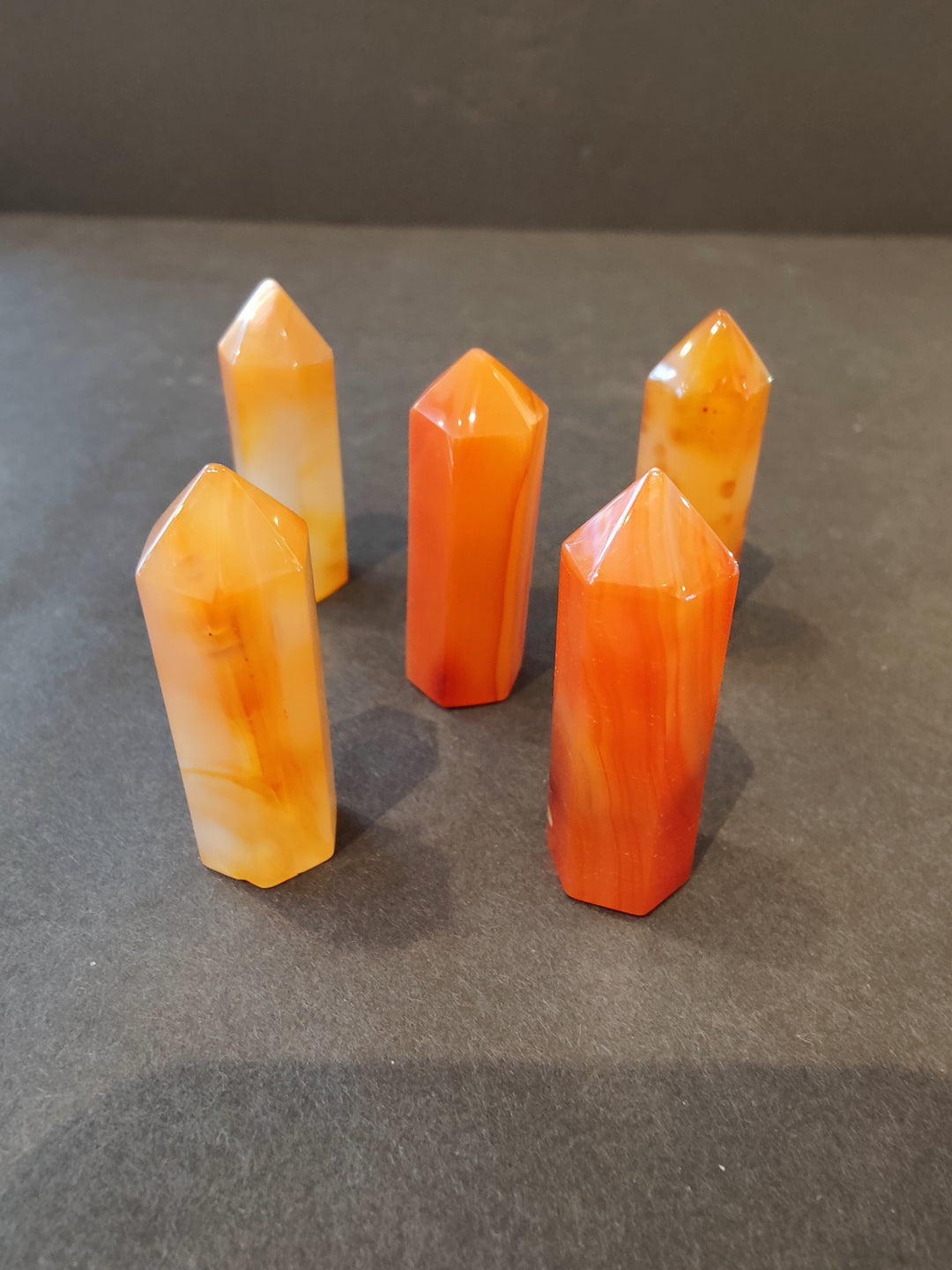 Orange crystal tower sculpture set with faceted tops and glossy points