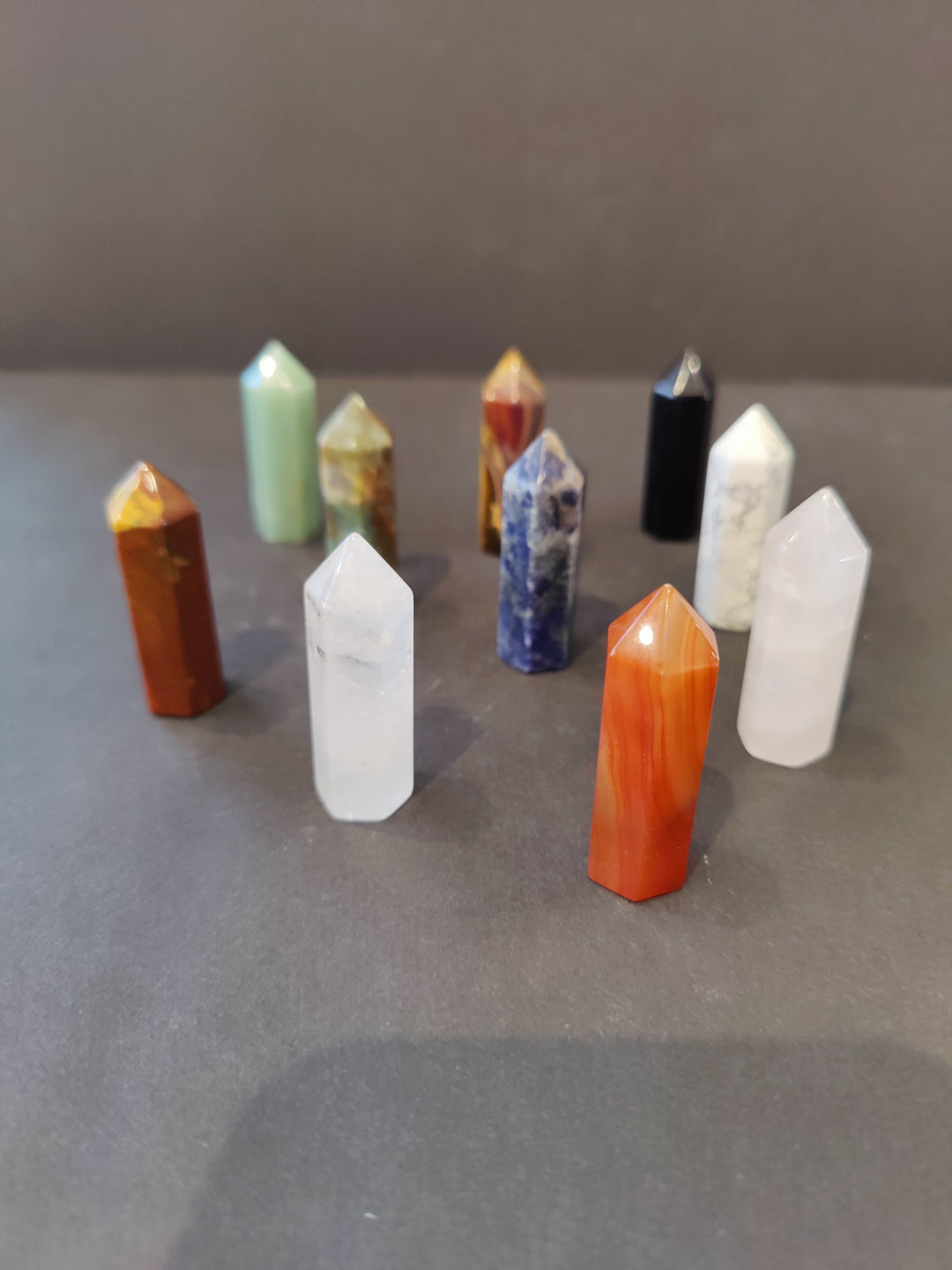 Multicolor crystal tower sculpture set with faceted tops and pointed bases